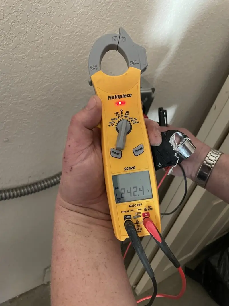 Voltage testing with clamp meter during Ceiling Fan Installation in Bolivar